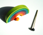 Naef rainbow on a white background with orange ball and wooden xylophone stick.