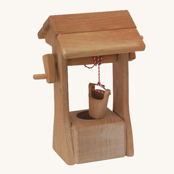 Ostheimer kids wooden water well toy with roof, on a beige background