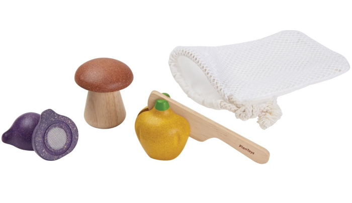 The veggie play food set from PlanToys includes a wooden bell pepper, shallot and mushroom with a knife for chopping and a handy bag to store them in