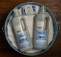 Bio-D fragrance free fabric conditioner and laundry liquid 1 litre bottles on top of a white towel, with bio-d laundry and stain remover bar