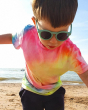 Close up of young boy wearing the Bird flexible childrens sunglasses on a beach
