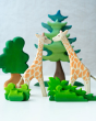 2 Ostheimer giraffe figures stood on a white background behind the Bumbu small and large wooden shrub toys