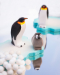 Bumbu handmade wooden penguins and penguin chick stood on a Bumbu ice floe block next to some Papoose felt snowballs 