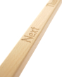 Close up of Coach House eco-friendly beech wood flashcard holder, showing the engraved 'next' writing