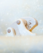 Close up of Bajo Tobe Yeti toy in a snowy scene