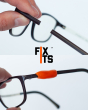 Close up of some broken glasses held together with a FixIts reusable plastic mending strip