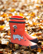 Frugi kids red wellington boots in some brown leaves