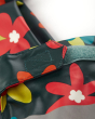 Close up of the adjustable velcro clasp on the Frugi childrens floral print rainy days jacket on a white background