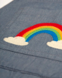 Close up of the embroidered rainbow on the Frugi organic cotton rio dungarees 