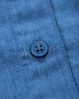 Close up of the buttons on the Frugi kids blue emma chambray floral dress