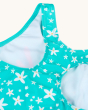 A closer look of the back on the Frugi Sally Swimsuit - Macaw. A beautiful lined teal blue swimsuit with a white flower print, on a cream background.