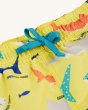 A close up of the light blue waist drawstring on the Frugi Boscastle Board Shorts - Banana Sharks, made from recycled bottles. A light banana yellow short with fun and colourful shark print, on a cream background