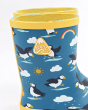 Close up of the yellow Frugi logo on the blue puffin print wellington boots on a white background