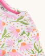 A closer look at the sleeve poppers on the Frugi Children's Organic Cotton Tallie Dress - White Echinacea