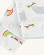 A close up of the white cuffed sloth and rainbow pull ups print, on the Frugi Children's GOTS Organic Cotton Frankie Summer Outfit - Sleepy Sloths, on a light cream background