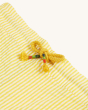 A closer view of the yellow draw string and waist band of the Frugi Archie Seersucker Shorts - Dandelion. A bright yellow and white striped short, made from GOTS organic Cotton on a cream background.