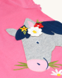 A closer view of the Frugi Children's Organic Cotton Elise Applique T-Shirt - Horse. A pink t-shirt with cap sleeves and gorgeous applique horse and flower detailing and soft rib neck, on a cream background