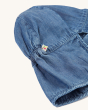 A closer look at the back neck covering on the Frugi Children's Organic Chambray Legionnaires Hat. On a cream background