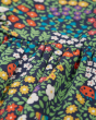 Close up of the garden life print on the Frugi organic cotton floral dani dress