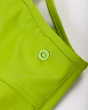 Close up of the poppers on the childrens Frugi waterproof puddle buster trousers