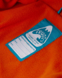 Close up of the hand me down name tag on the Frugi National Trust puddle buster rain jacket