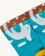 A closer view of the details on the Frugi Children's Organic Cotton Little Socks 3 Pack - Sloths. These socks are blue with an adorable sloth hanging from the cuff and yellow heels and toes