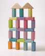 A large building has been made using the Grimms Wooden Pastel Duo Blocks. The roof is made from the natural blocks, with the rest of the building being created with the pastel blocks