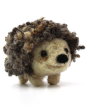 A closer view of The Makerss Needle Felt Small Curly Hedgehog. A beautifully crafted curly haired hedgehog with a cute cream face and legs, a black nose and curly spines stood on a white background