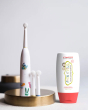 Jack N' Jill Fluoride-Free Strawberry Toothpaste 200g pictured next to buzzy brush toothbrush