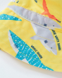 A close up view of the shark detail and stitching on the Frugi Harbour Swim Hat - Banana Sharks. A banana yellow sun hat with colourful shark print details, on a cream back ground. The hat is made from quick drying, recycled fabric that meets UPF 50+. 