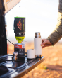 Close up of a Klean kanteen reusable tkpro flask on a car tailgate next to some camping equipment