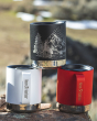 A collection of Kleen Kanteen 12oz Camping Mugs stacked on top of a rock