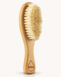 Kokoso natural wooden baby hairbrush on a cream background