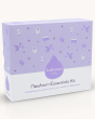 The Kokoso Newborn Essentials Organic Baby Gift Set in its purple and white box, stood upright on a cream background