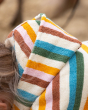 A closer look at the hood and towelling material of the Little Green Radicals Baby Rainbow Hooded Towel Poncho.