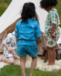Children playing together in front of a tent. The child in the middle is wearing the Little Green Radicals Organic Cotton Dusk Button Through Pyjama Short Set. Made from GOTS organic Cotton, these beautiful light blue pyjama shorts and top have delicate s