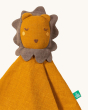 A closer look at the fabric and design of the Little Green Radicals Lion Organic Cotton Soft Toy on a cream background