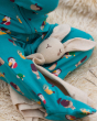 A closer look at the foot of the Little Green Radicals Garden Birds Organic Cotton Zip Babygrow and a bunny comforter