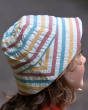 A closer view of the stitching, stripes and pattern Little Green Radicals Walnut Striped Reversible Sun Hat. A beautiful reversible sunhat made with GOTS Organic Cotton with rainbow stripes and a tie that fastens under the chin