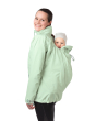 A person with a child in the back carrier of the Mamalila Outdoor Explorer Babywearing Jacket - Mint