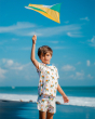 A child flying a kite on a sunny day wearing the Maxomorra Children's Organic Cotton Turtle Pyjama Set. This set can also be used for every day wear too!