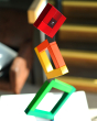Naef Angular construction toy balanced in a tower on a white table