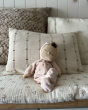 Olli Ella Lullaby Dozy Dinkum Doll - Luna is posed in a sitting position on a cushion.