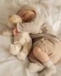 Olli Ella Lullaby Dozy Dinkum Doll - Lyra, with a baby cuddling the doll asleep.