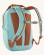 The back of the Patagonia Atom Tote Backpack 20L - Skiff Blue, showing the chest strap, shoulder straps and padding on the back of the bag, on a cream background