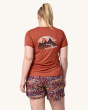 An adult showing the swift on the front of the Patagonia Women's Capilene Cool Daily Graphic Shirt. This photo shows the fit of the t-shirt from the back
