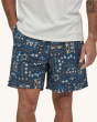 A person wearing Patagonia Men's Baggies Shorts Longs, with a white t-shirt showing the fit of the shorts from the front