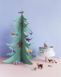 Studio Roof hanging cardboard animal decorations hanging from a wooden Christmas tree in front of a blue wall 
