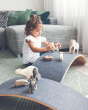 Girl playing with wooden toys on a Wobbel Pro Felt balance board