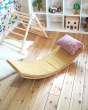 Wobbel eco-friendly deck and pillow cushion accessories next to a triclimb climbing frame on a wooden floor